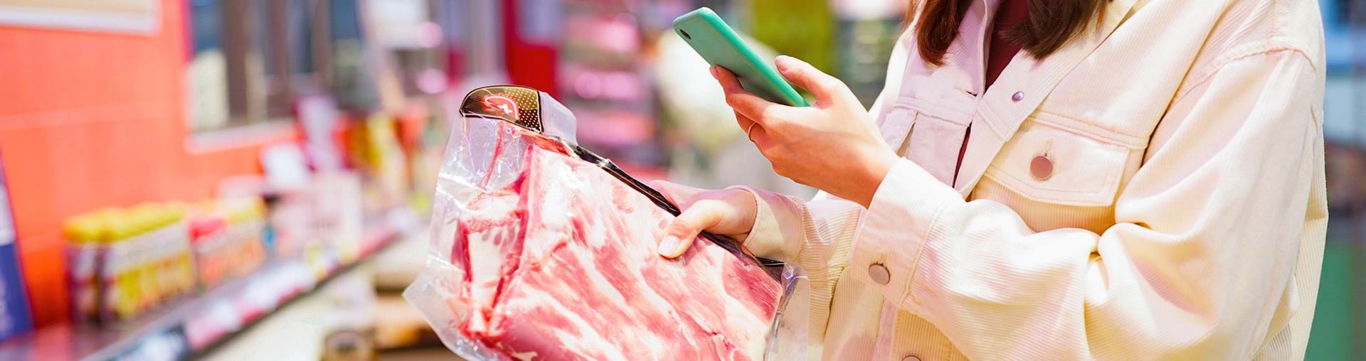 Consumer purchasing meat product