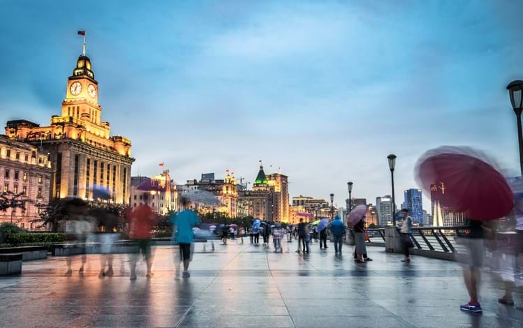 Blurred image of people walking the street